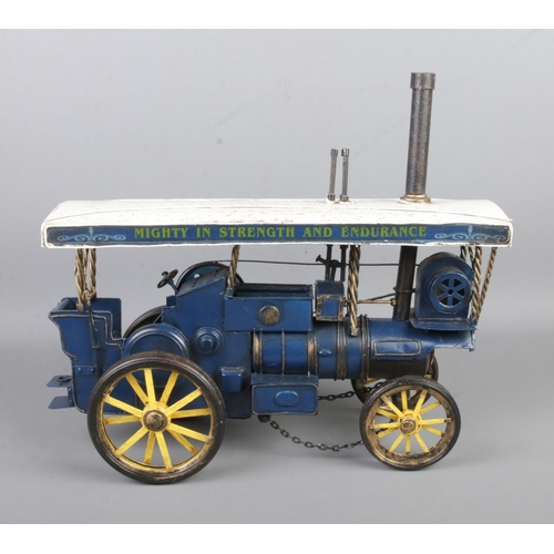 54 - A boxed model steam engine in yellow, white and blue beating motto 'Mighty in Strength and Endurance... 