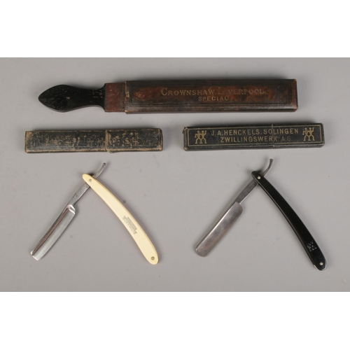 6 - Two cut throat razors, Bismarck and J.A Henckels, along with Crownshaw, Liverpool Razor strop.