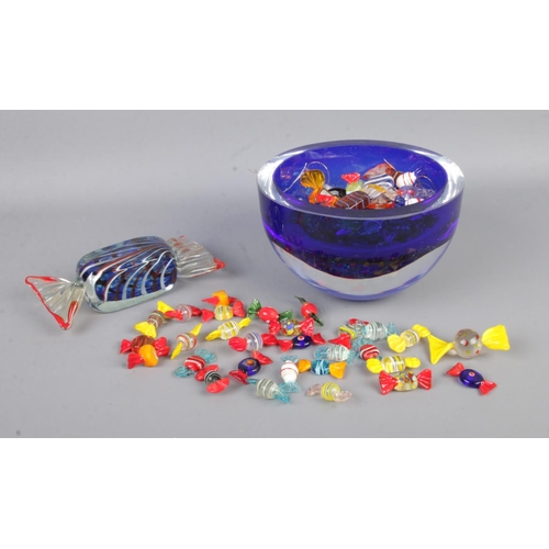 64 - A large collection of Murano style glass sweets, in glass bowl with one large example.