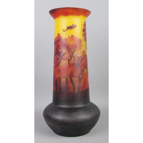 65 - A Galle style glass vase of bulbous form, with tapered neck depicting a forest scene. Height: 31cm.