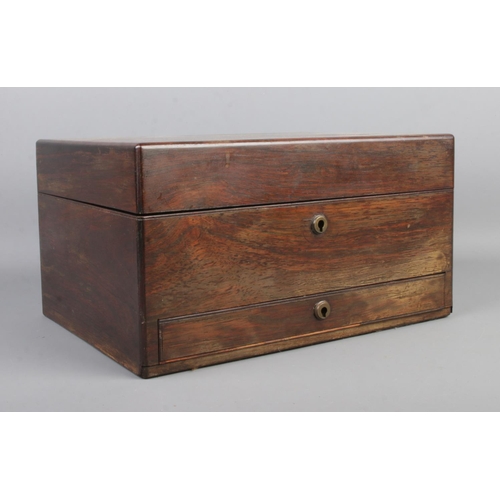 68 - A mid Nineteenth century rosewood two tier vanity box, with lower drawer. Featuring fitted interior ... 