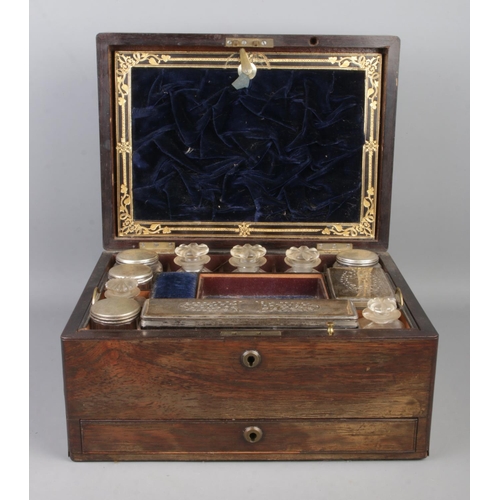 68 - A mid Nineteenth century rosewood two tier vanity box, with lower drawer. Featuring fitted interior ... 