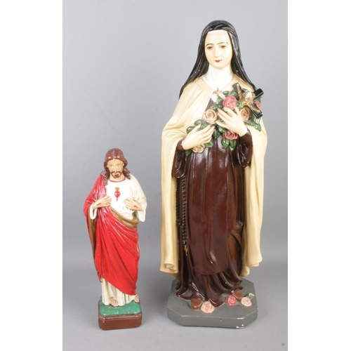 69 - Two plaster religious figures including large figure of the Saint Therese of Lisieux and small examp... 