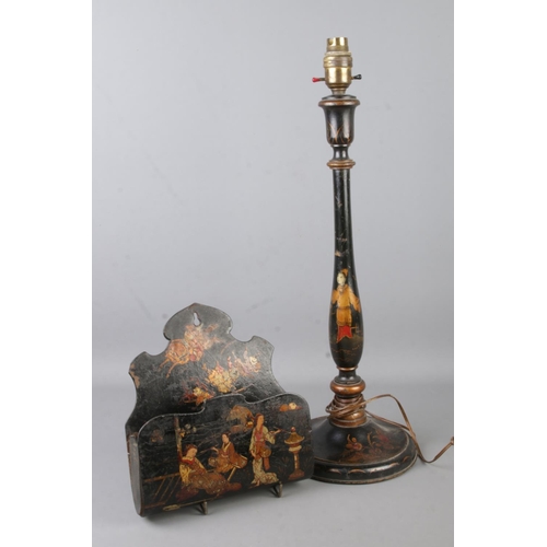 72 - A Japanned and lacquered table lamp along with similar wall pocket.