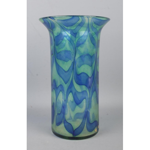 74 - A Cowdy studio glass vase, decorated in blues and greens. Signed to base. Height: 23.5cm