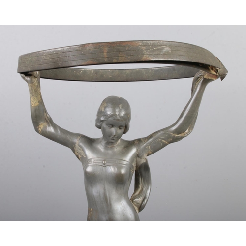 467 - An Art Nouveau Imperial Zinn Bitter & Gobbers pewter centerpiece, 5300, formed as a woman in flowing... 