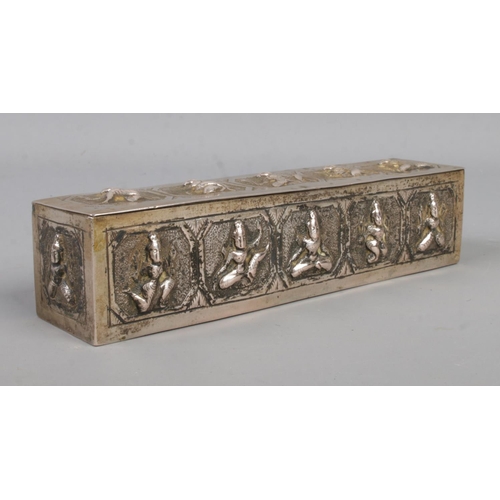 475 - A Burmese hinged box of oblong form, depicting Deities to the sides. Length: 15.5cm. Weight: 142.9g.