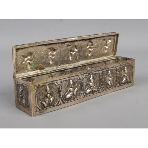 475 - A Burmese hinged box of oblong form, depicting Deities to the sides. Length: 15.5cm. Weight: 142.9g.