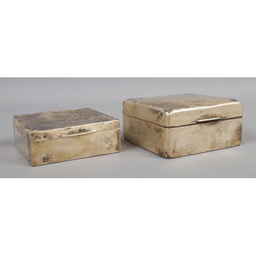 478 - Two silver mounted cigarette boxes of near square form, one assayed for Birmingham, 1924 by Wilmot M... 