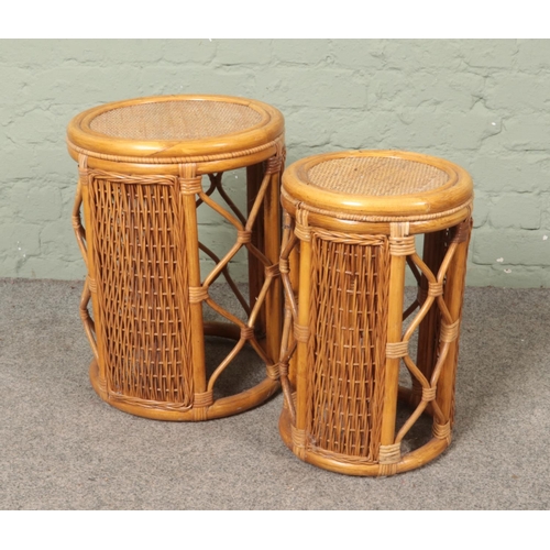 491 - A set of two bamboo circular nesting tables. Approx. height of tallest example 50cm.