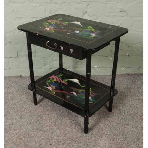 507 - A two tier Japanese lacquered side table with single drawer decorated with Mount Fuji landscape. App... 