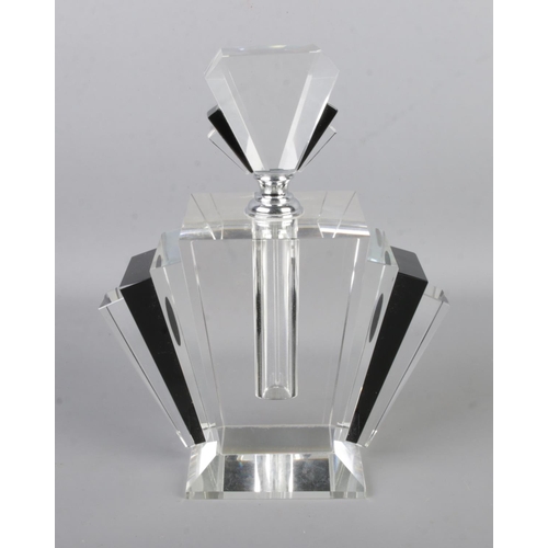 96 - A large Art Deco style scent bottle featuring black coloured accents. Approx. height 23cm.