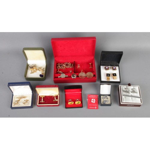 90 - A collection of mostly costume jewellery cufflinks to include 9ct white gold plated silver example, ... 