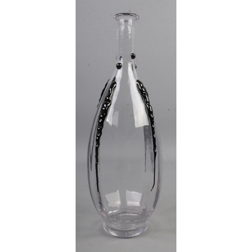 470 - A Daum Nancy France clear glass bottle with applied black decoration.