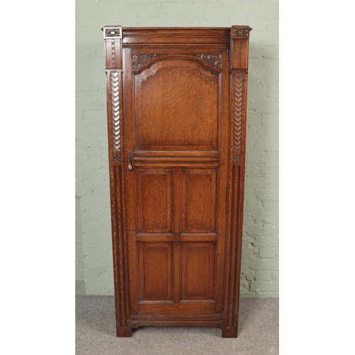 503 - An oak carved single wardrobe/ cupboard.

Hx182cm
Wx78cm
Dx40cm