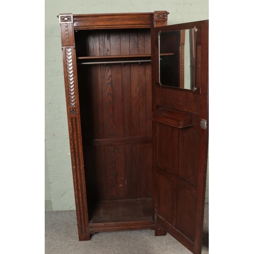 503 - An oak carved single wardrobe/ cupboard.

Hx182cm
Wx78cm
Dx40cm