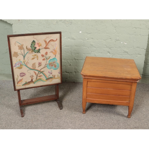 504 - An antique commode together with an embroided screen/fold over table