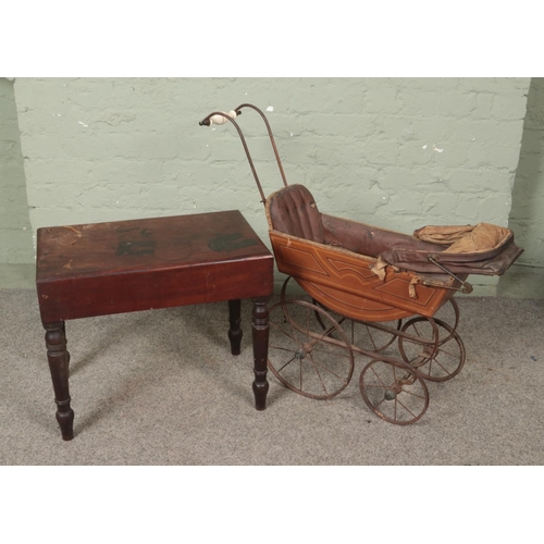 528 - A Victorian baby bath table along with a child's toy pram