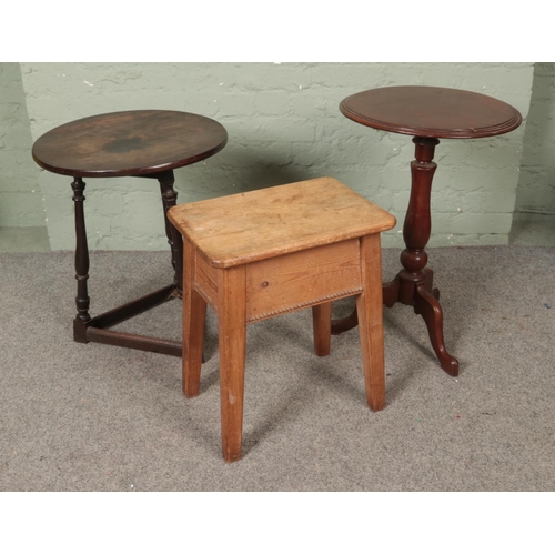 529 - An antique oak cricket table with Victorian mahogany wine table and rustic pine stool