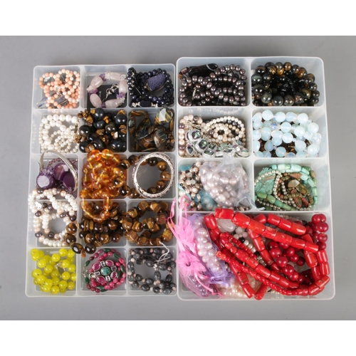 89 - Two trays of good quality gemstone costume jewellery including amethyst, tigers eye, cultured pearls... 