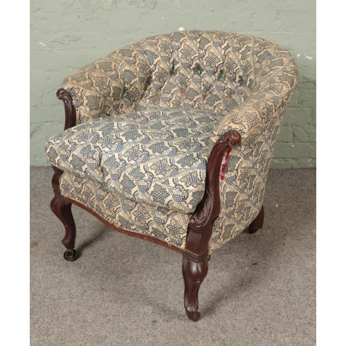 535 - A Victorian tub armchair with finished with vintage Laura Ashley grape pattern upholstery