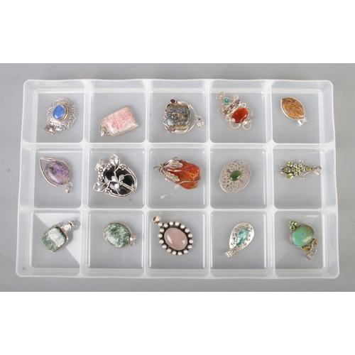 97 - A large collection of silver pendants and brooches including seraphinite and turquoise examples