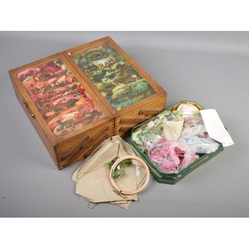 9 - A sewing box filled with embroidery threads mostly including Anchor examples with another tin of thr... 