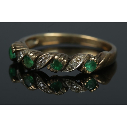 368 - A 9ct gold emerald and diamond ring. Size L. Total weight: 1.9g.