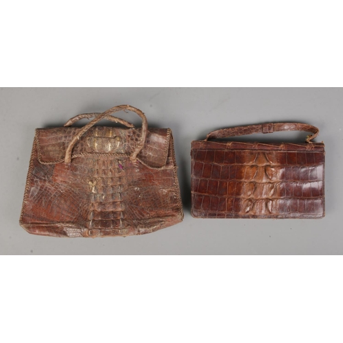 104 - Two vintage ladies snakeskin purses, one featuring internal compact mirror.