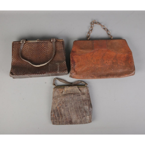 108 - Three ladies vintage crocodile skin purses of varying sizes.