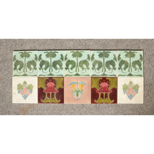 109 - A collection of early 20th century Art Nouveau dust pressed colour tiles in various patterns includi... 