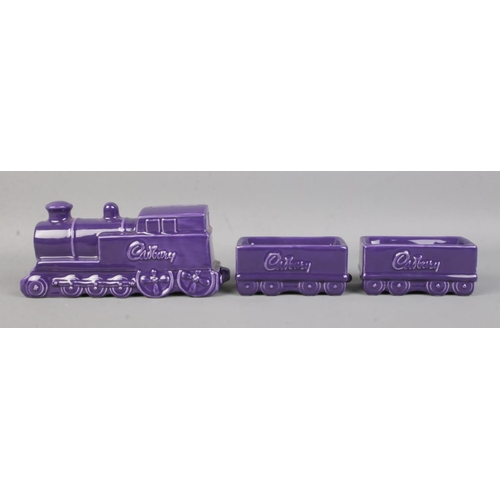 11 - A Wade Cadbury money box, with two additional carriages.