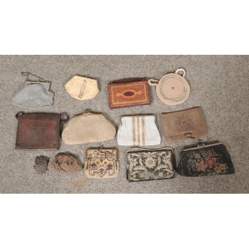 110 - A collection of vintage ladies evening purses to include beaded, petite pointe and goldwork examples... 