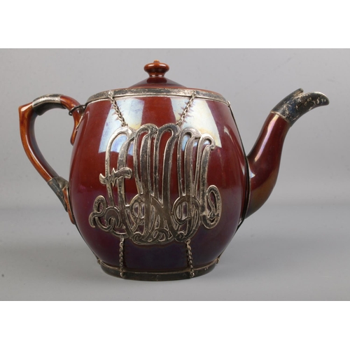 117 - A Victorian silver overlay ceramic teapot with large applied monogram to front