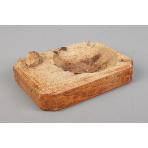 15 - An oak 'Acornman' ashtray, produced by Alan Grainger. Length: 10cm, Width: 7.5cm.