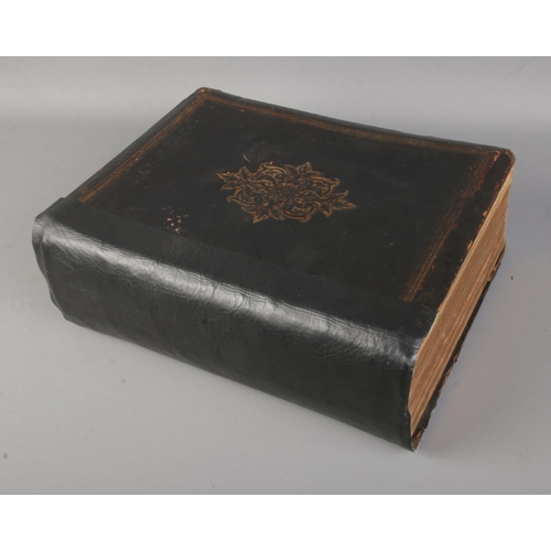 37 - Cassell's Illustrated Family Bible featuring leather tooled and gilt cover. Published by Cassell, Pe... 