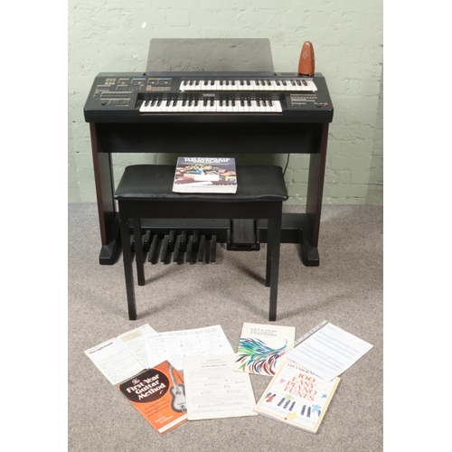 277 - A Yamaha Electone HC-2 Electronic Organ, with footstool, a large collection of sheet music and metro... 