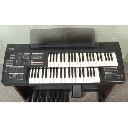 277 - A Yamaha Electone HC-2 Electronic Organ, with footstool, a large collection of sheet music and metro... 