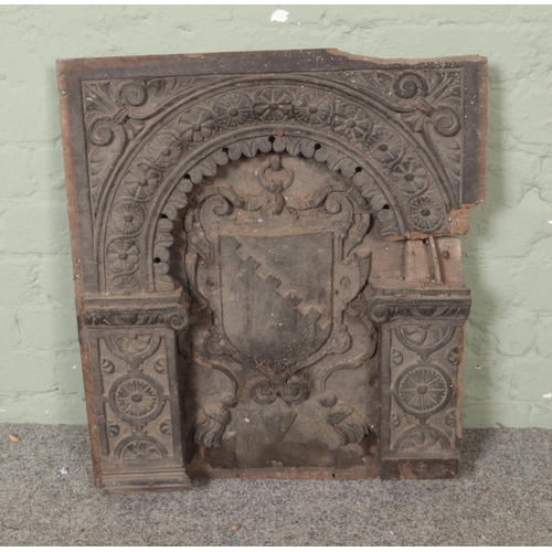 292 - A heavily carved panel decorated with heraldic shield crest situated within floral arch. Approx. dim... 