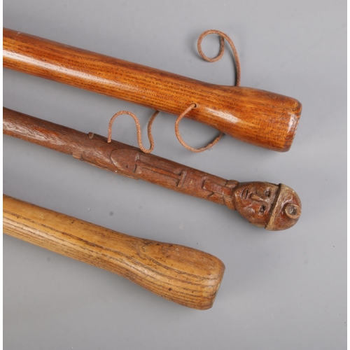 45 - Three miners hand carved walking canes to include example with pommel formed as the head of a miners... 