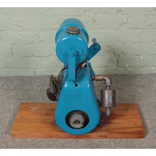 304 - A J.A.P Model 25 stationary engine mounted on wooden plinth