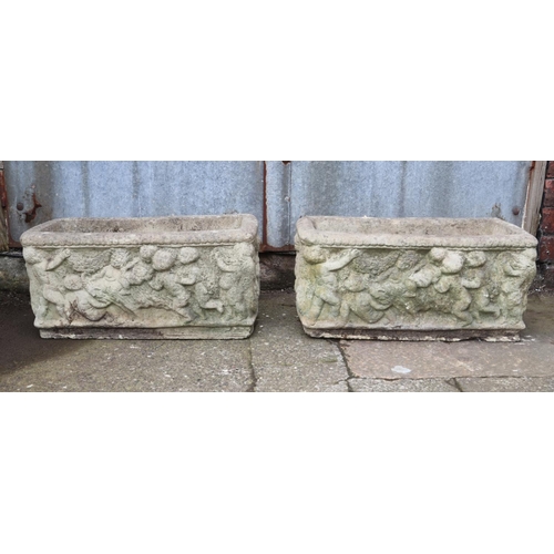 307 - Two stone troughs with cherub decoration 

Hx26cm
Wx55cm