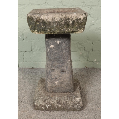 312 - A small stone garden birdbath. Height: 48cm.