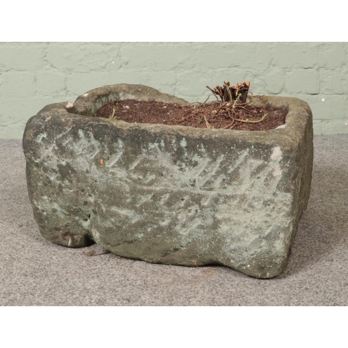 313 - A stone garden planter of rectangular form. Dimensions: 24cm x 46cm x 37cm.