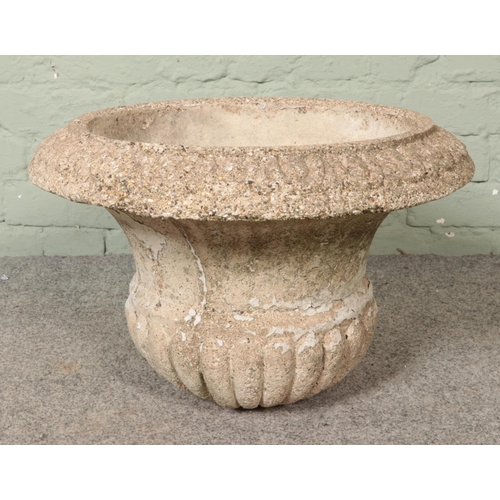 314 - A large concrete garden urn, with flared rim. Diameter: 51cm.