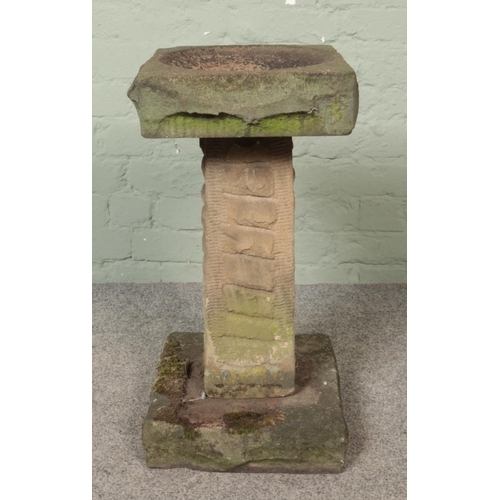 317 - A garden stone birdbath. Height: 64cm.