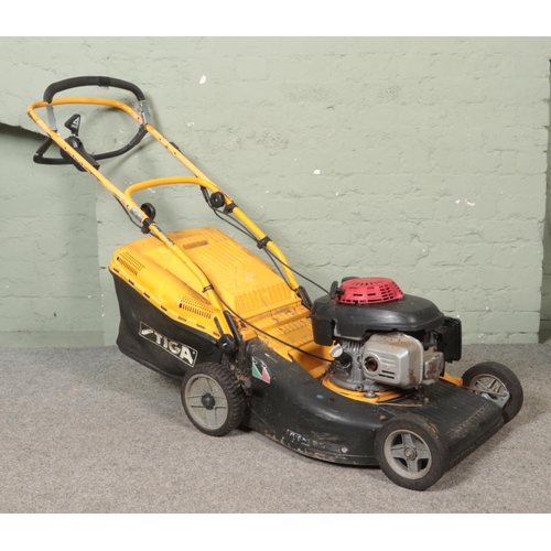 319 - A Stiga four speed petrol powered lawnmower.