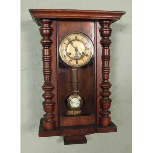 327 - A German Kienzle walnut cased wall clock