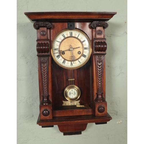 328 - A Hamburg American Clock Co HAC wall clock with carved supports and gilt carving and finial to crest