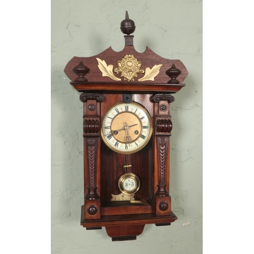 328 - A Hamburg American Clock Co HAC wall clock with carved supports and gilt carving and finial to crest